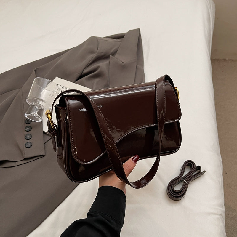 Tira | Sac épaule brillant avec design ondulé