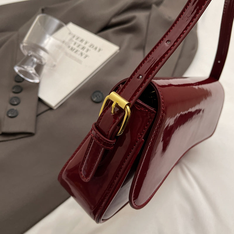 Tira | Sac épaule brillant avec design ondulé