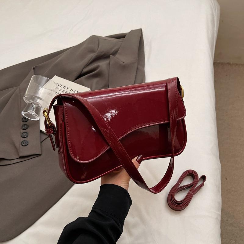 Tira | Sac épaule brillant avec design ondulé