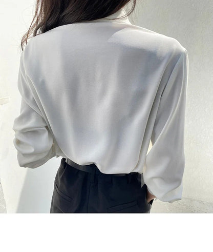 Verfijnde geplooide dames blouse met lange mouw