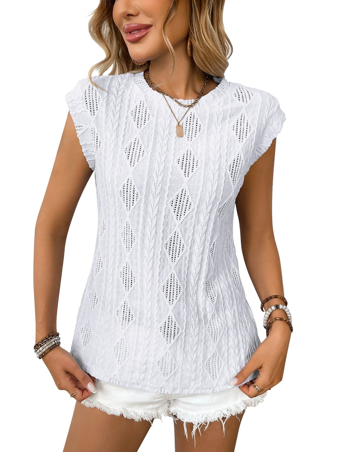 Top tricoté élégant pour dames avec structure torsadée et coupe ample