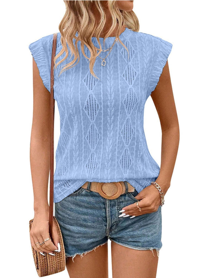 Top tricoté élégant pour dames avec structure torsadée et coupe ample