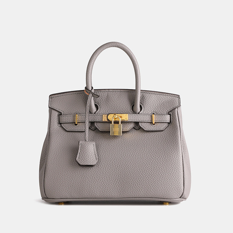 Elegant Women's Handbag with Gold-Toned Lock Detail