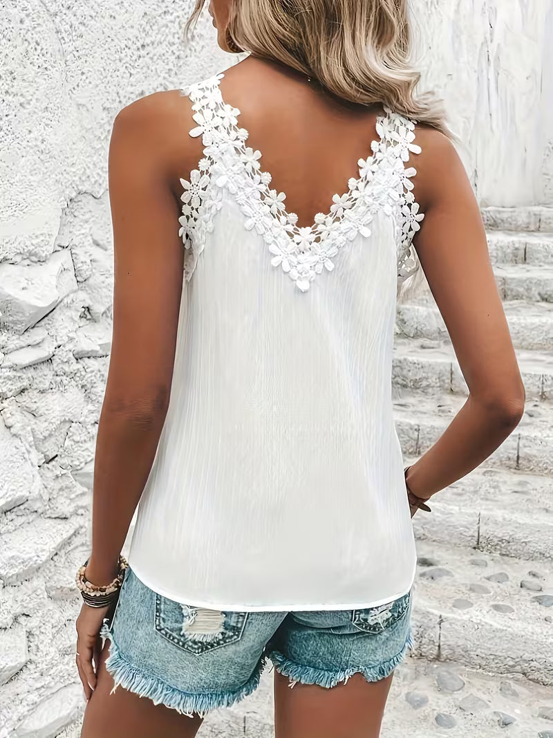 Top pour dames avec broderie florale et bretelles spaghetti