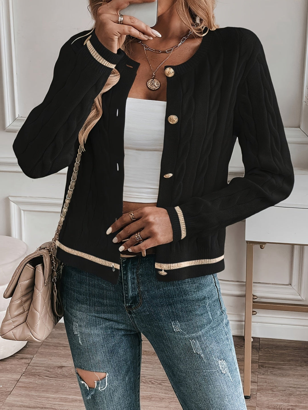 Josephine cardigan styled open over a white camisole, close-up front detail